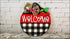 Round welcome sign with cherries and bow, handmade wooden decor for rustic home entryway